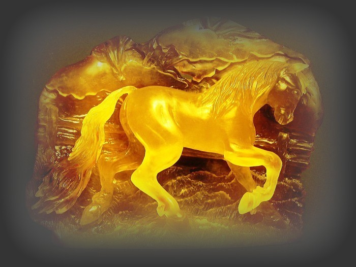 Horse - relief, Baltic amber sculpture. Amber Słupsk Sławomir Chowaniec.